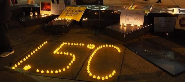 "1.5 degrees C spelled out in tiny candles on the sidewalk"